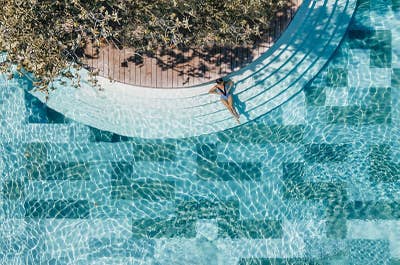 Woman in a pool of Amorita Resort