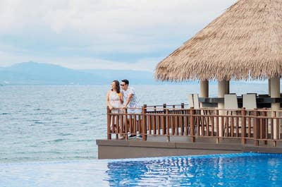 A couple enjoying the beautiful view from Dusit Mactan Resort