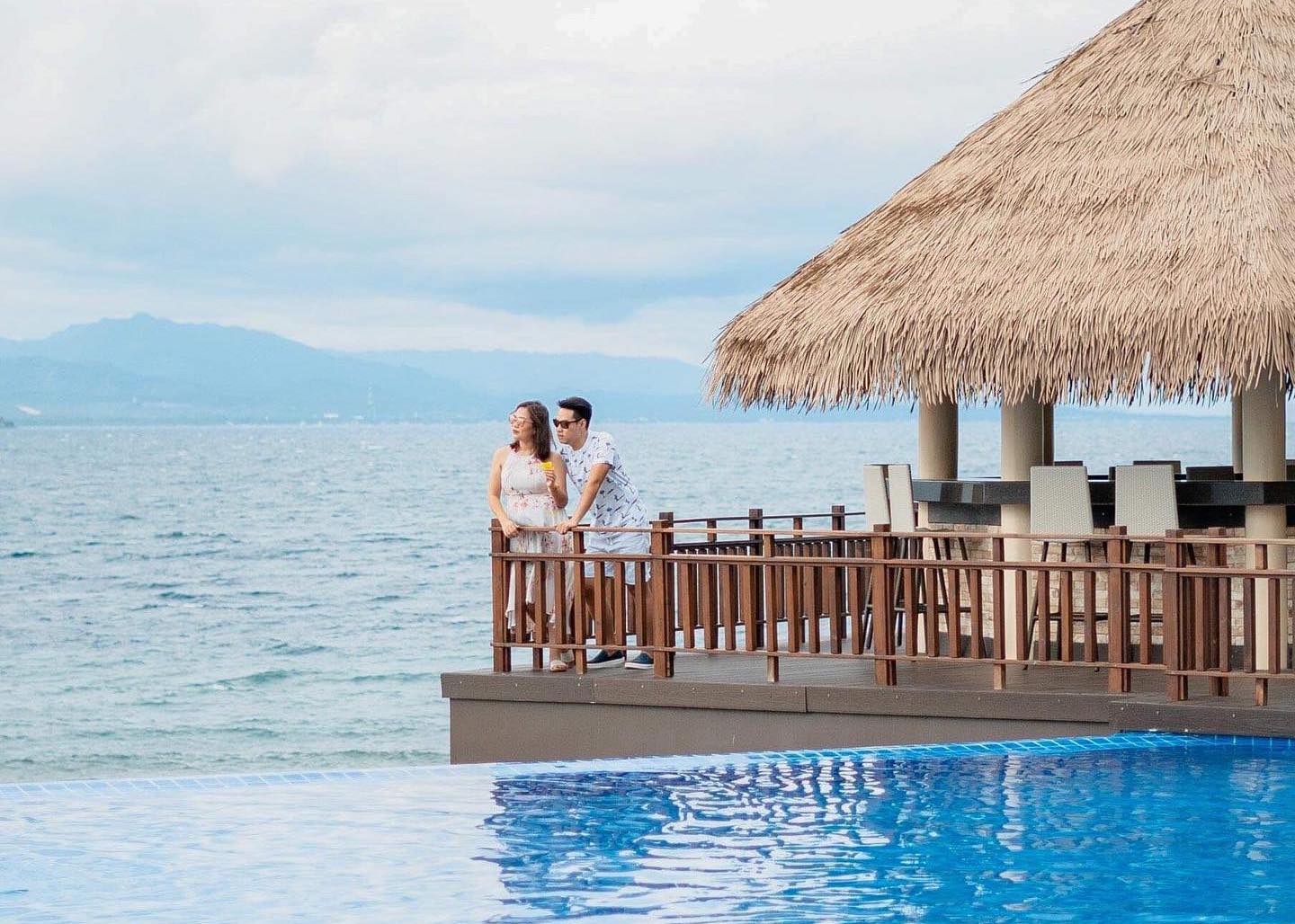 A couple enjoying the beautiful view from Dusit Mactan Resort