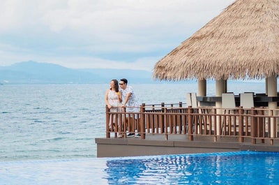 A couple enjoying the beautiful view from Dusit Mactan Resort