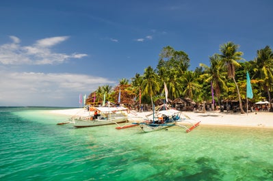 Colorful boats docked in Puerto Princesa Honda Bay