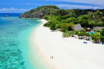 Long stretch of white sand beaches of Club Paradise Resort