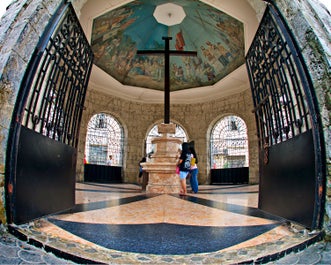 Locals praying in Magellan's Cross in Cebu