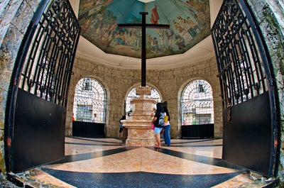 Locals praying in Magellan's Cross in Cebu