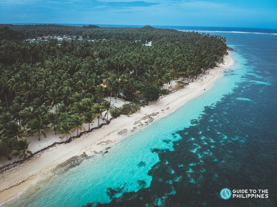 Drone shot of the enchanting Alegria beach in Siargao Drone shot of the enchanting Alegria beach in Siargao