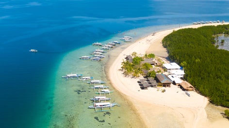 Boats docked on the beach of Starfish Island