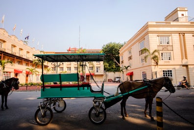 Kalesa parked in front of a building in Intramuros, Manila