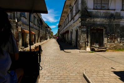 Exploring Calle Crisologo while riding a Kalesa