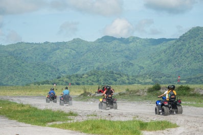 Tourists riding a 4x4 in Mt. Pinatubo