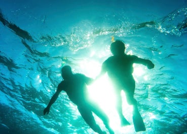 People enjoying the clear waters of The Muse Hotel