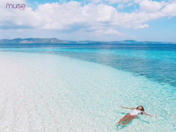 A girl floating on Boracay's clear waters