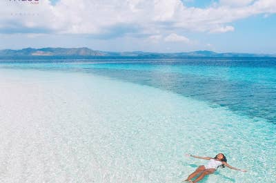 A girl enjoying the clear blue waters of Boracay