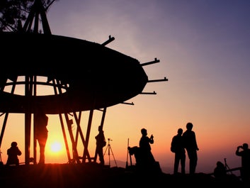 People visiting Mines View Park during sunset