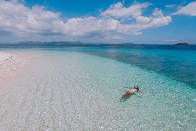 A woman enjoying the waters of Starfish Island in Palawan