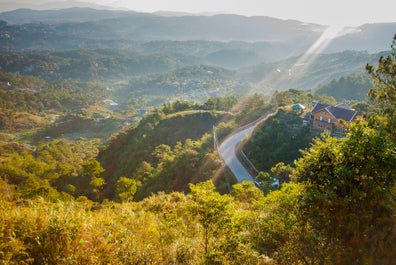 Sunrise over a road in Baguio