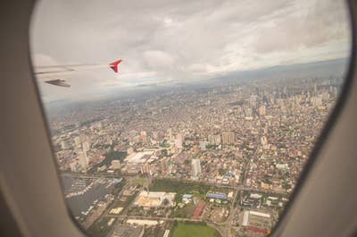 Window seat view in an airplane going to Manila