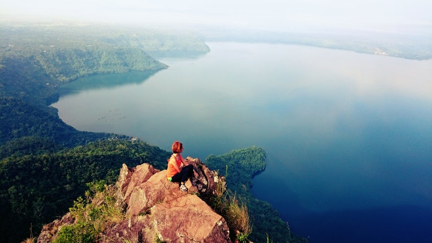 Woman enjoys the view from Mt. Maculot in Batangas Woman enjoys the view from Mt. Maculot in Batangas