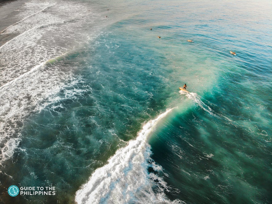 Surfer rides a wave in La Union Surfer rides a wave in La Union