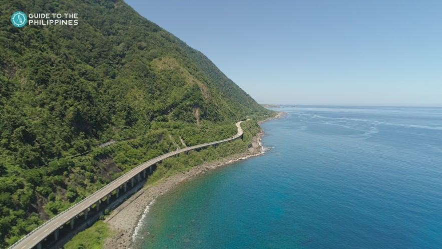 The Patapat Viaduct in Ilocos Norte lines a coastal mountain The Patapat Viaduct in Ilocos Norte lines a coastal mountain