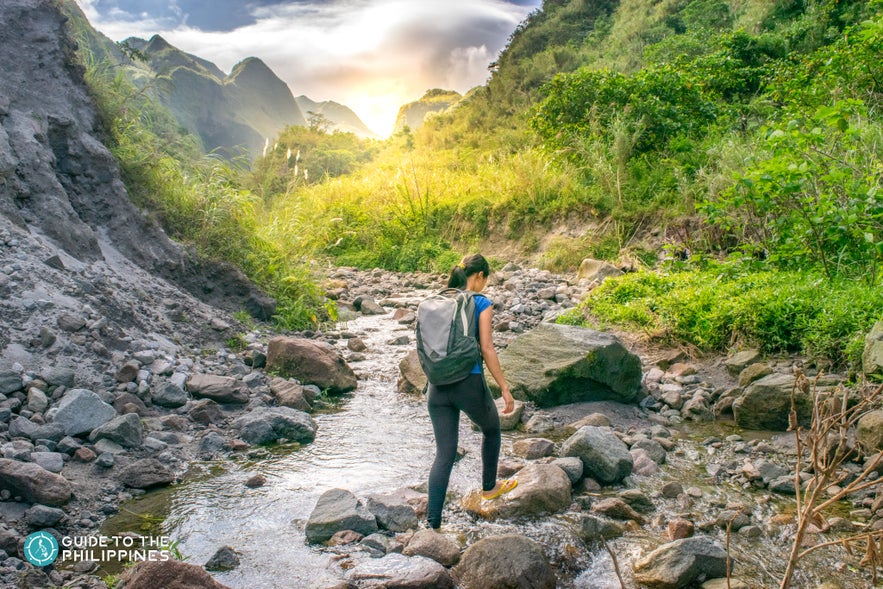 Woman hiking up Mt. Pinatubo Woman hiking up Mt. Pinatubo