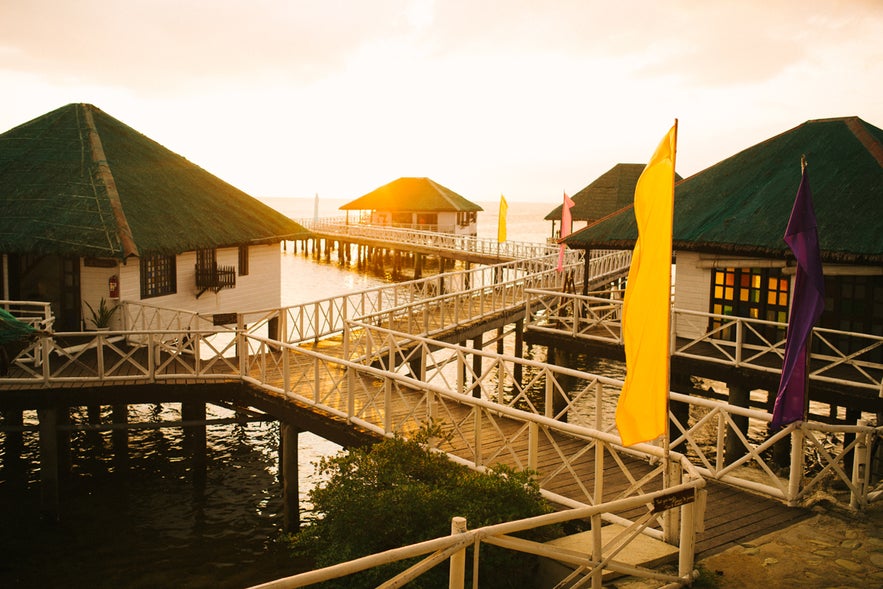 Cottages in Stilts Calatagan Beach Resort during sunset Cottages in Stilts Calatagan Beach Resort during sunset