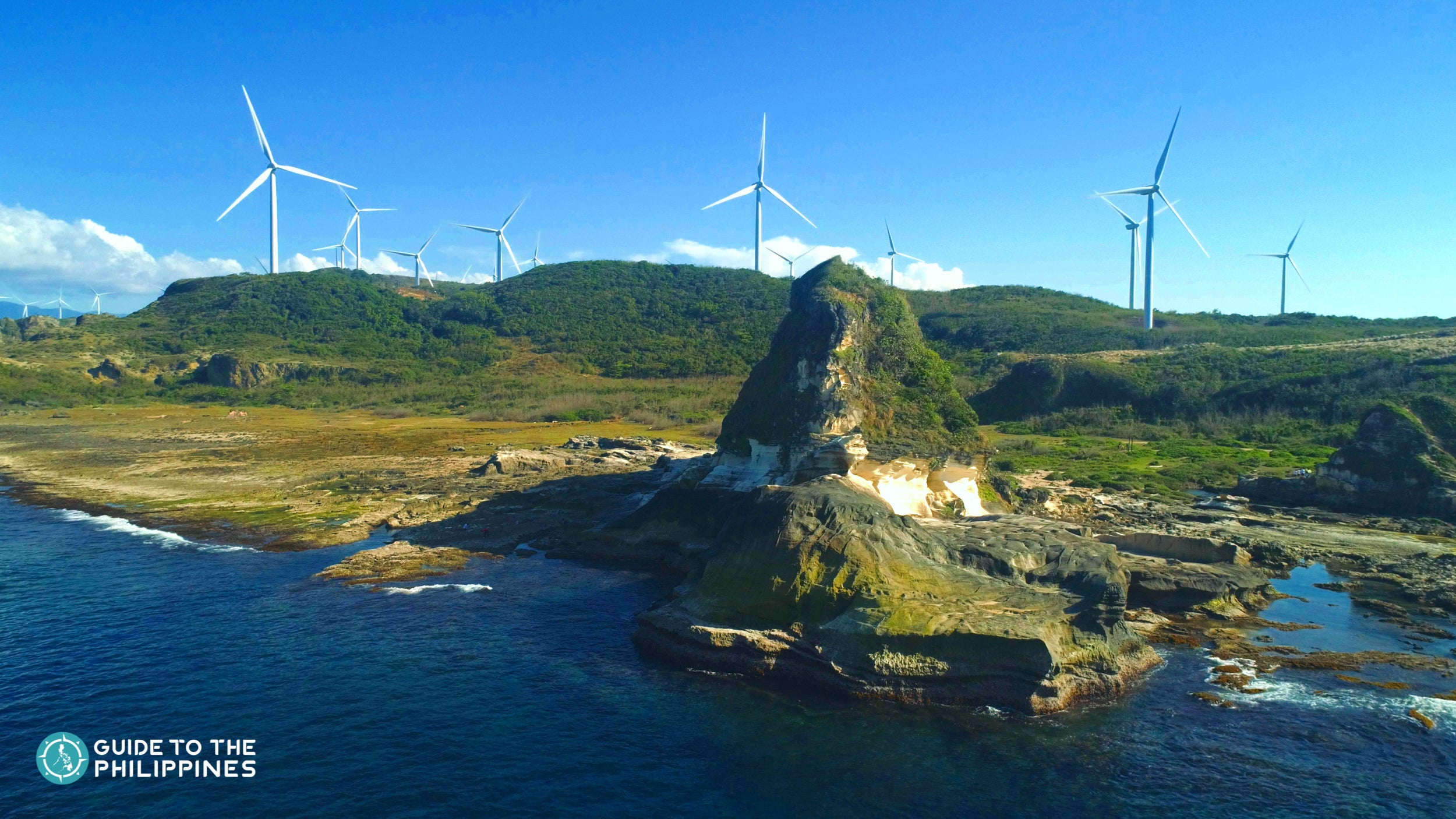 View of the windmills at the Kapurpurawan Rock Formations