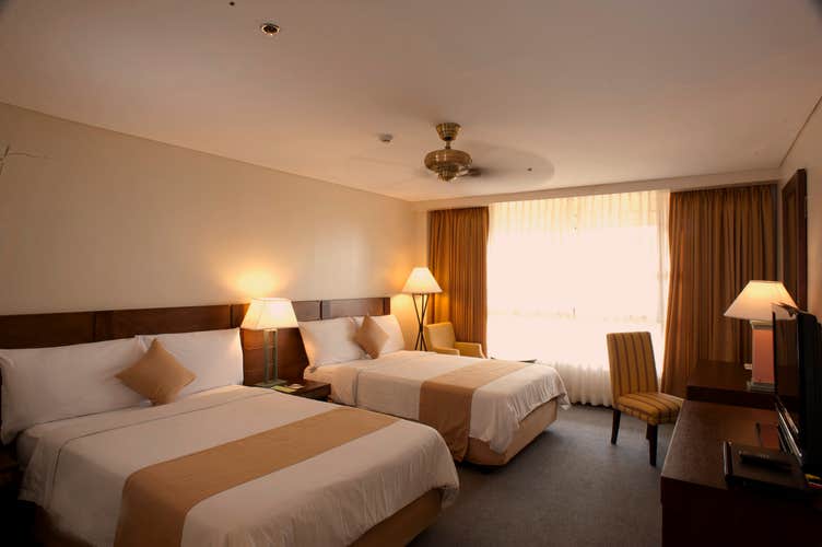 Double bed inside a superior room at The Forest Lodge in Camp John Hay Baguio
