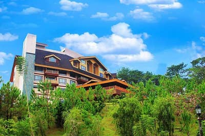 Facade of the building of The Forest Lodge at Camp John Hay