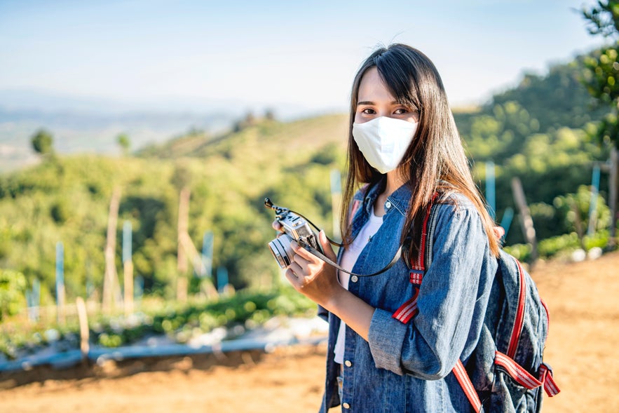 Traveler wearing face mask Traveler wearing face mask