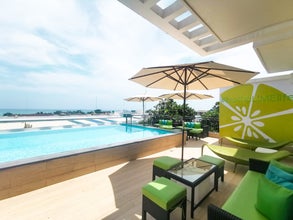 Relax by Lime Hotel’s rooftop poolside during your Boracay Island vacation package.