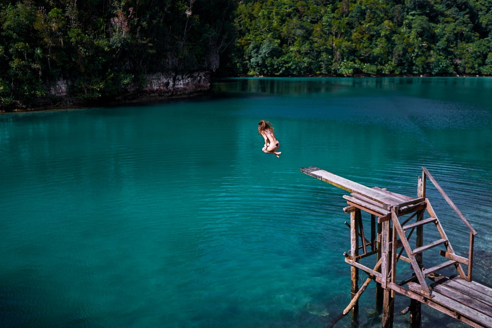 You can jump off the wooden diving board at Sugba Lagoon during this tour off the coast of Siargao Island