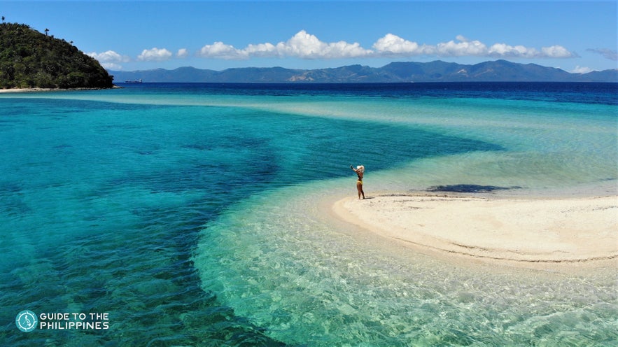 Woman standing on Bonbon Beach Woman standing on Bonbon Beach