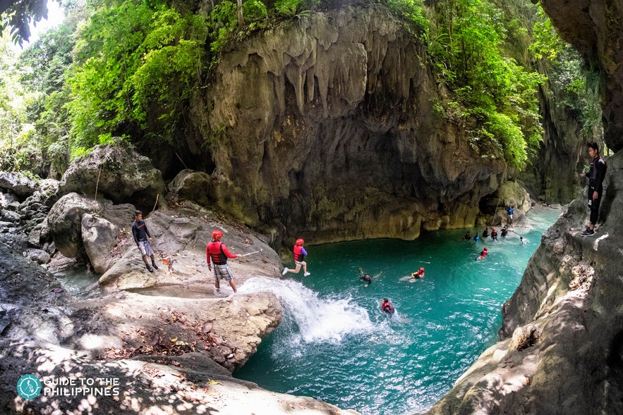 Tourists canyoneering in Badian, Cebu Tourists canyoneering in Badian, Cebu