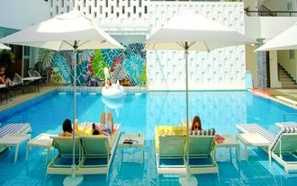 Unwind by the inviting swimming pool at Coast Resort, a relaxing part of this Boracay tour package.