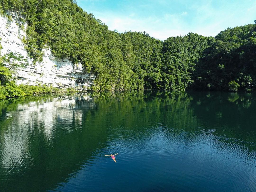 A person floating in Lake Bababu