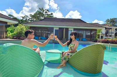 Couple enjoying at TAG Resort swimming pool