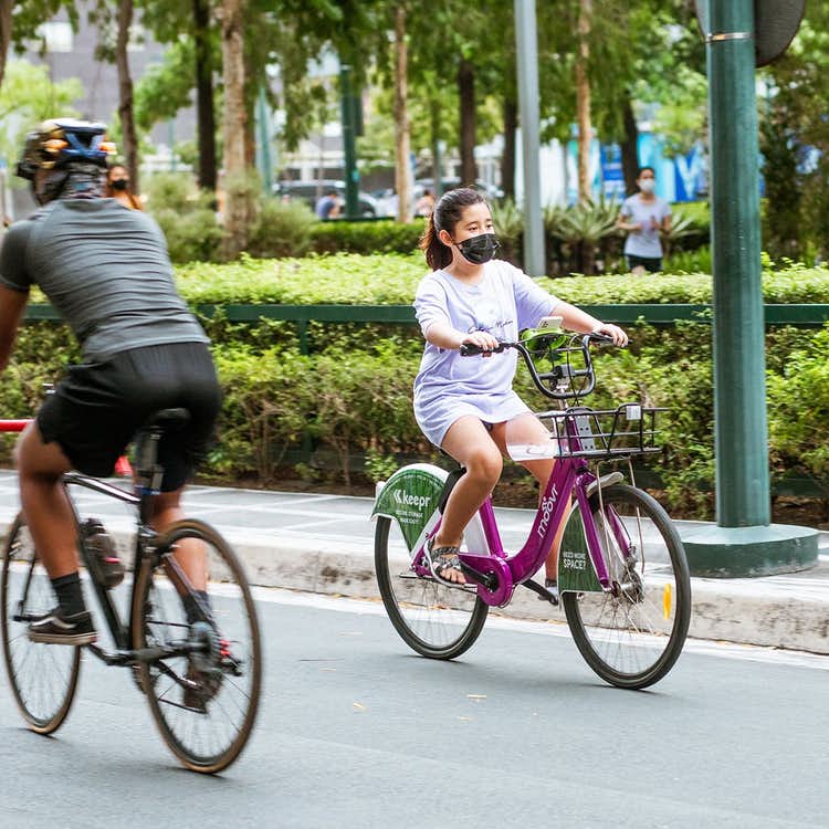 Girl biking in Bonifacio Global City Girl biking in Bonifacio Global City