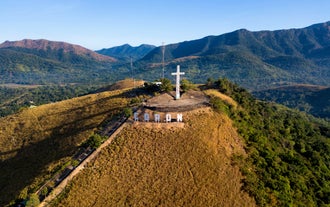 An aerial view of Mt. Tapyas showcasing its iconic cross, a highlight of this cultural heritage and hot springs tour in Coron town