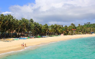 Stroll across soft sand and enjoy the peaceful vibe at Tambisaan Beach during this inland tour in Boracay Island, perfect for cruise passengers.