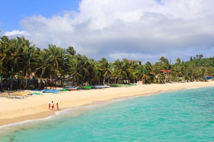 Stroll across soft sand and enjoy the peaceful vibe at Tambisaan Beach during this inland tour in Boracay Island, perfect for cruise passengers.