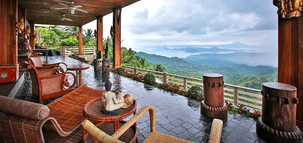 The al fresco lounge area at The Oriental Luxury Suites Hotel has scenic hillside views, which you can enjoy on this 3-day, 2-night tour package in Tagaytay City