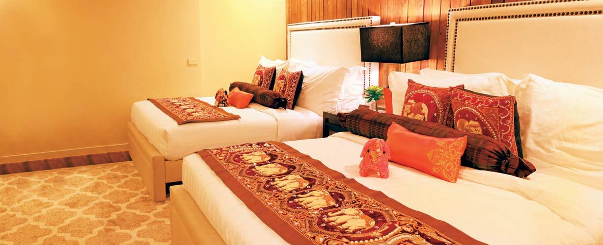 This spacious and elegant room at The Oriental Luxury Suites Hotel is the perfect place to unwind for this travel package in Tagaytay City.