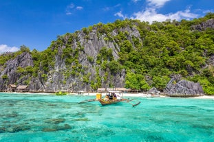 After a smooth Coron Airport transfer, relax on the peaceful shores of Banul Beach