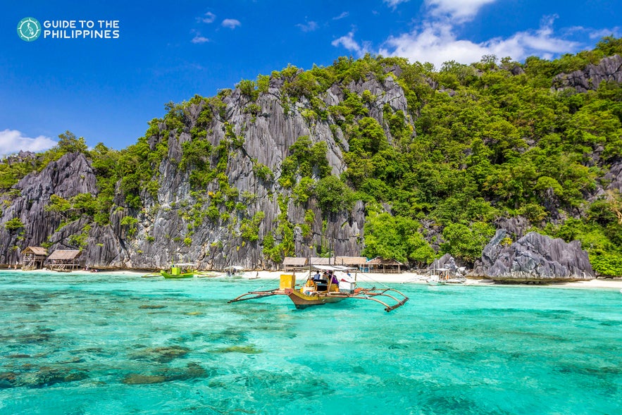 Boat sailing from an island in Coron Boat sailing from an island in Coron