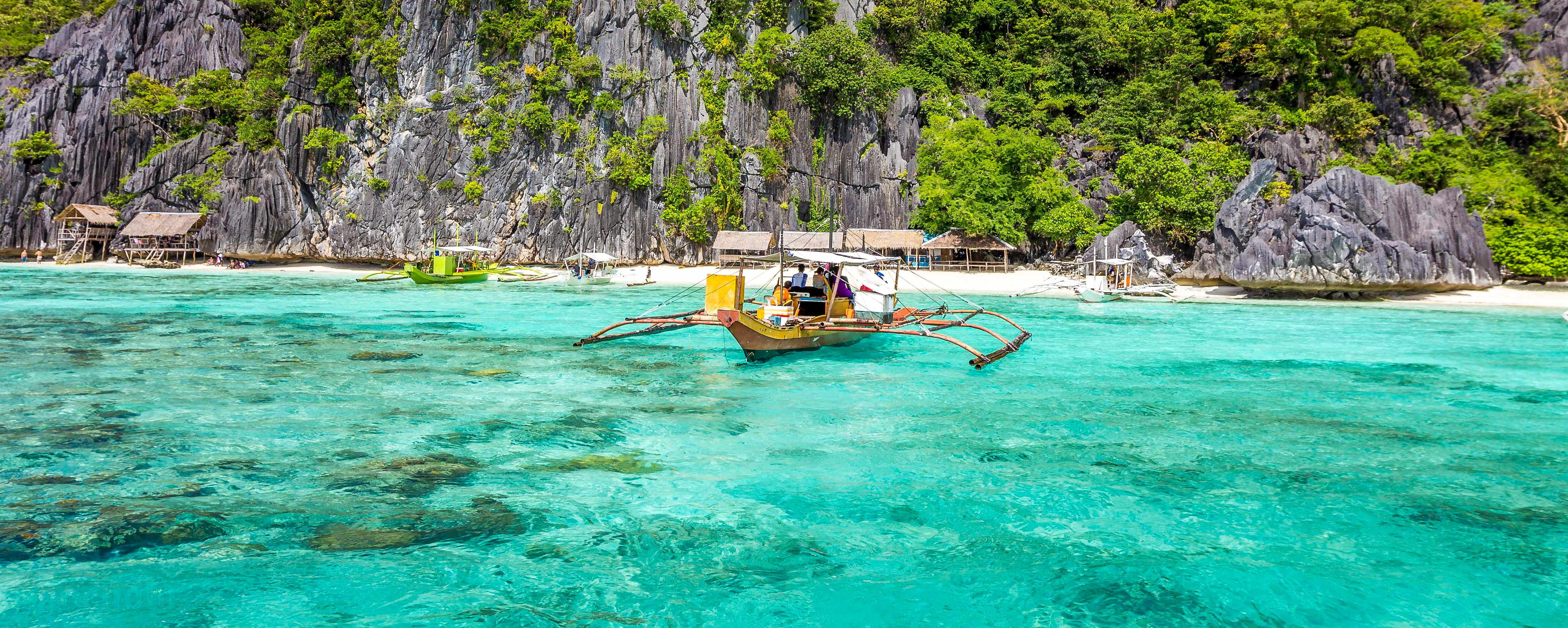 Boat sailing from an island in Coron.jpg