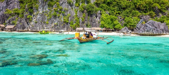 Boat sailing from an island in Coron.jpg