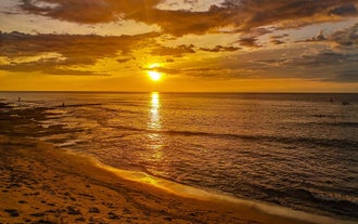 Visit a beach in the town of San Juan during this tour in La Union Province