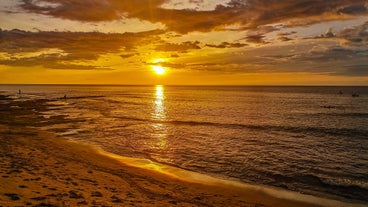 Visit a beach in the town of San Juan during this tour in La Union Province