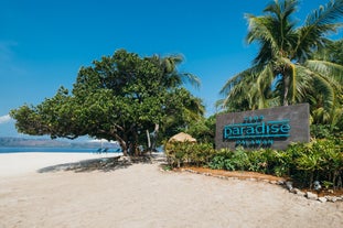 Signage of Club Paradise found at the entrance of the Resort