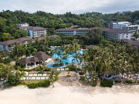 Enjoy a luxury getaway at Movenpick Resort & Spa, a beachfront accommodation included in your Boracay Island tour package